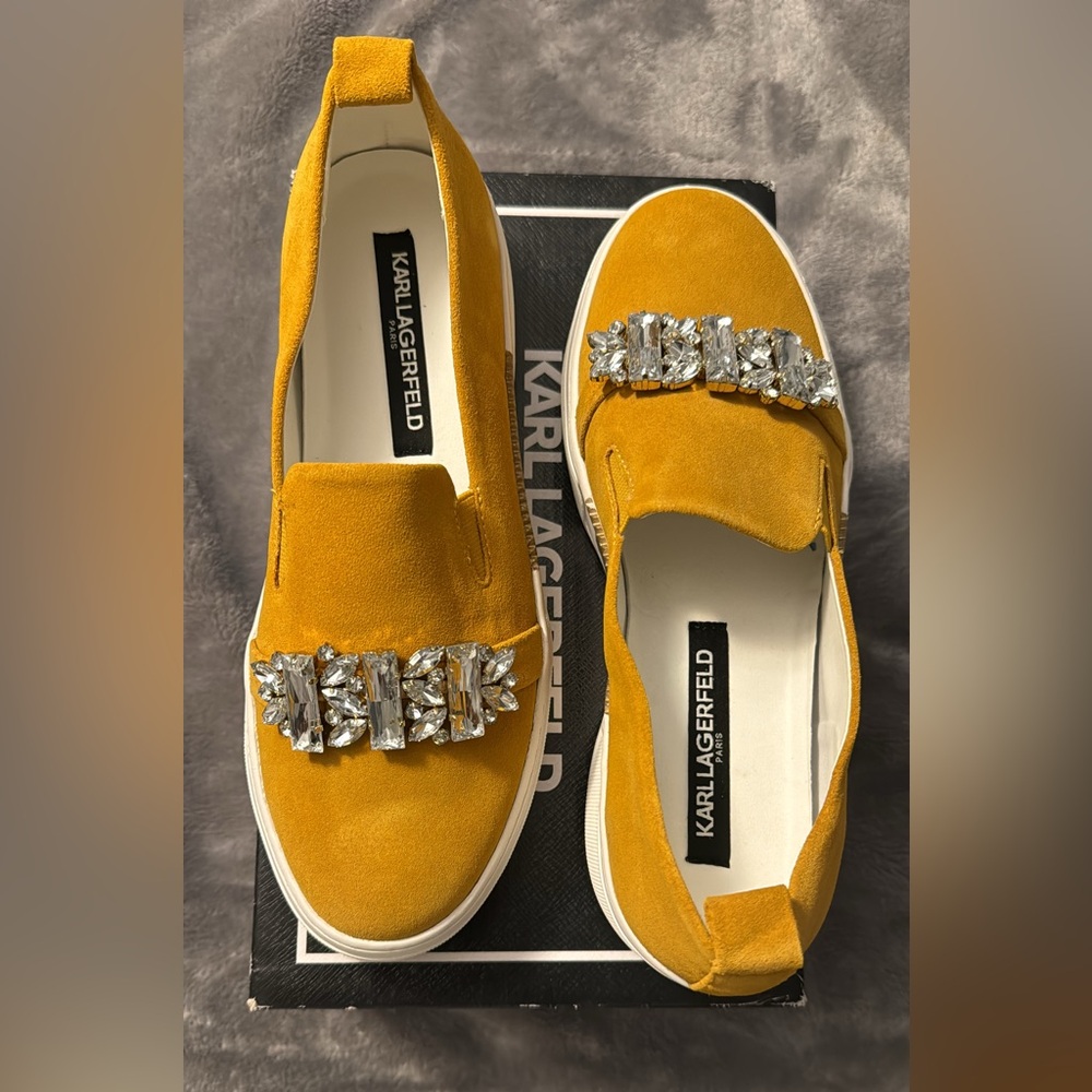 New in original packaging, Karl Lagerfeld mustard slip ons with embellishments.